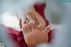 A close up of a person's foot with a red nail polish.